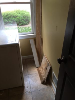 laundry room with water damage - before picture