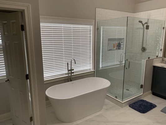 newly remodeled tub and shower area of bathroom